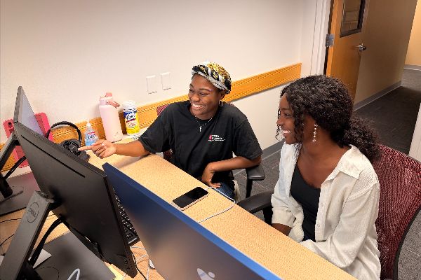 Logann Snow working along side a Temple student worker.